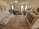 Living room with fireplace, stylish decor, and hardwood floors at 609 Rowan Mills Rd, Salisbury, NC 28147