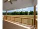 Relaxing back deck offering serene views of the lush green landscape and a blue sky at 4808 Glen Stripe Dr # Cal0036, Indian Trail, NC 28079