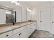 A bright bathroom features dual sinks, modern fixtures, and a glass enclosed shower with tile surround at 4808 Glen Stripe Dr # Cal0036, Indian Trail, NC 28079