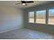 Bright bedroom with three large windows and natural light with covered floors at 4808 Glen Stripe Dr # Cal0036, Indian Trail, NC 28079