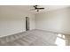 Neutral bedroom features a ceiling fan and doorway leading to other rooms in the home at 4808 Glen Stripe Dr # Cal0036, Indian Trail, NC 28079