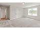 Spacious bedroom with natural light, neutral walls and carpet flooring at 4808 Glen Stripe Dr # Cal0036, Indian Trail, NC 28079