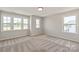 Bright bedroom with multiple windows offering natural light and outdoor views at 4808 Glen Stripe Dr # Cal0036, Indian Trail, NC 28079
