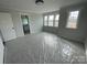 Bedroom featuring natural light, modern ceiling fan, and doorway to bath at 4808 Glen Stripe Dr # Cal0036, Indian Trail, NC 28079