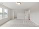 Bright bedroom with a closet, neutral walls and carpet flooring and a large window at 4808 Glen Stripe Dr # Cal0036, Indian Trail, NC 28079