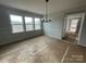 Bright dining area with large windows and modern chandelier at 4808 Glen Stripe Dr # Cal0036, Indian Trail, NC 28079