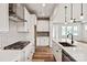 Contemporary kitchen with an island, stainless steel appliances, stylish backsplash, and modern cabinetry at 4808 Glen Stripe Dr # Cal0036, Indian Trail, NC 28079