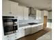 Modern kitchen featuring white cabinetry, stainless steel appliances, and an elegant subway tile backsplash at 4808 Glen Stripe Dr # Cal0036, Indian Trail, NC 28079