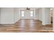 Open living room featuring hardwood floors, natural light and a ceiling fan at 4808 Glen Stripe Dr # Cal0036, Indian Trail, NC 28079