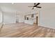 Open living space featuring wood-look floors, modern lighting, and a seamless transition to the kitchen at 4808 Glen Stripe Dr # Cal0036, Indian Trail, NC 28079