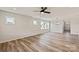Bright living room with wood-look flooring, neutral walls, and ample natural light at 4808 Glen Stripe Dr # Cal0036, Indian Trail, NC 28079