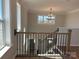 Elegant staircase featuring dark iron spindles and hardwood steps leading to the upper level at 4808 Glen Stripe Dr # Cal0036, Indian Trail, NC 28079