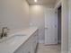 Bathroom with white vanity and marble-look floors at 1133 Heather Oak Ln, Oakboro, NC 28129