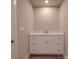 Modern bathroom with white vanity and quartz countertop at 1133 Heather Oak Ln, Oakboro, NC 28129