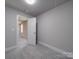 Cozy bedroom with an open door to another room at 1133 Heather Oak Ln, Oakboro, NC 28129