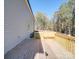 Wooden deck provides backyard access, offering views of surrounding trees at 1133 Heather Oak Ln, Oakboro, NC 28129