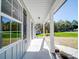 Inviting front porch with white columns and view of yard at 1133 Heather Oak Ln, Oakboro, NC 28129