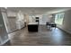 An open floor plan reveals the kitchen featuring stainless appliances, a large island, and a dining area at 1133 Heather Oak Ln, Oakboro, NC 28129