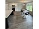 Modern eat-in kitchen features stainless appliances, white cabinetry, and a large window with a view at 1133 Heather Oak Ln, Oakboro, NC 28129