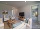 Comfortable living room featuring plush seating, a cozy rug, and a modern entertainment center, creating a welcoming atmosphere at 1133 Heather Oak Ln, Oakboro, NC 28129