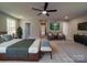 Spacious main bedroom with sitting area and TV at 1133 Heather Oak Ln, Oakboro, NC 28129