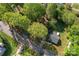 Overhead aerial shot of a home situated on a tree-lined street in a suburban neighborhood at 209 21St St, Newton, NC 28658
