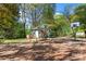 Backyard features a playhouse, swings, basketball hoop, and a dog house at 209 21St St, Newton, NC 28658