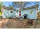 Cozy backyard with an outdoor dining set, brick pavers, barbecue grill and a fire pit at 209 21St St, Newton, NC 28658