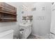 Bathroom featuring a vanity, mirror, towel rack and tiled floor; providing a functional space at 209 21St St, Newton, NC 28658
