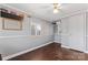 Neutral bedroom features hardwood floors, a window, and playful decorations, offering a versatile space at 209 21St St, Newton, NC 28658
