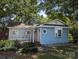 View of a charming house with light blue siding, well-kept landscaping, and a welcoming entrance at 209 21St St, Newton, NC 28658
