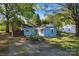 Aerial view of a charming home with light blue siding, lush landscaping, and inviting entrance at 209 21St St, Newton, NC 28658