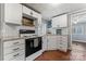 Bright kitchen with white cabinets, black appliances, and subway tile backsplash for a modern touch at 209 21St St, Newton, NC 28658