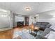 Cozy living room featuring hardwood floors, ample natural light, and comfortable gray sofa at 209 21St St, Newton, NC 28658