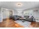 Inviting living room with hardwood floors, large windows, and comfortable seating arrangement at 209 21St St, Newton, NC 28658