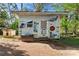 Charming playhouse adorned with colorful signage and next to a small dog house at 209 21St St, Newton, NC 28658