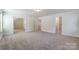 Large bedroom with access to multiple rooms and ample closet space at 5304 Verona Rd # 76, Charlotte, NC 28213