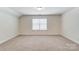 Bright bedroom with a window and neutral decor at 5304 Verona Rd # 76, Charlotte, NC 28213