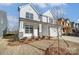 Landscaped front yard of a two-story house with stone accents at 5304 Verona Rd # 76, Charlotte, NC 28213