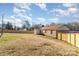 Expansive backyard features a wooden fence that surrounds the perimeter of the property at 1007 Ashford St, Charlotte, NC 28214