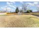 Fenced in backyard featuring an outbuilding and large trees scattered throughout the yard at 1007 Ashford St, Charlotte, NC 28214