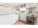 Practical laundry area with modern washer, dryer, and convenient outdoor access at 1007 Ashford St, Charlotte, NC 28214