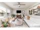 Bright living room featuring stylish decor, a modern ceiling fan, and neutral color palette at 1007 Ashford St, Charlotte, NC 28214