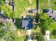 Aerial view of the home showcasing a well-maintained yard and surrounding greenery at 8932 Myra Way, Charlotte, NC 28215