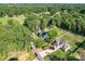 Areal view of property showcasing mature trees and large manicured yard at 8932 Myra Way, Charlotte, NC 28215