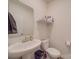 Bright half bathroom with pedestal sink and modern fixtures at 8932 Myra Way, Charlotte, NC 28215