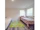 bedroom with two beds and a colorful rug on luxury vinyl plank flooring at 8932 Myra Way, Charlotte, NC 28215