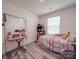 Bedroom with luxury vinyl plank flooring, desk and natural light at 8932 Myra Way, Charlotte, NC 28215