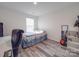 Bedroom with a window, bed, and guitar at 8932 Myra Way, Charlotte, NC 28215