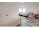 bedroom featuring two beds and luxury vinyl plank flooring at 8932 Myra Way, Charlotte, NC 28215